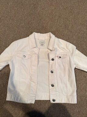 White denim jacket with silver buttons